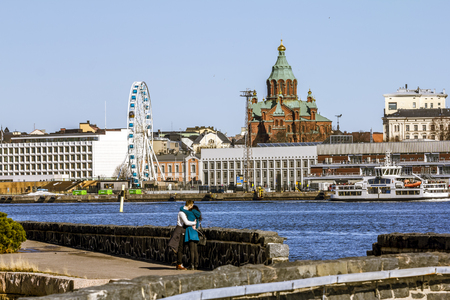 Helsinki. Finland.April 7, 2018.Holy Orthodox Uspensky Cathedral and Ferris wheel in Helsinki.Finland.のeditorial素材