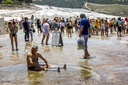 Pamukkale. Turkey.June 7, 2018.Tourists on white  slopes and thermal springs and travertines of Pamukkaleのeditorial素材