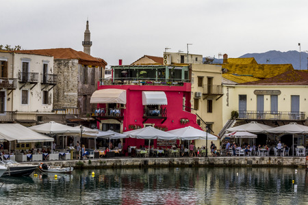 Rethymno. Crete.29 may 2019.View of the promenade and houses against the mountains in Rethymno in Greece.のeditorial素材