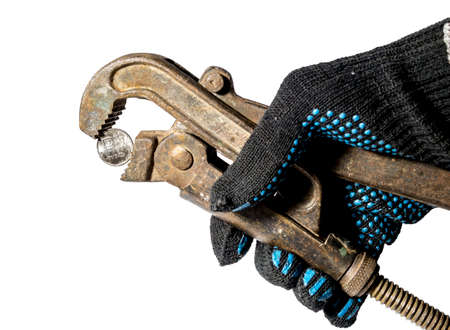 The ruble coin is clamped with a wrench isolated on a white backgroundの写真素材