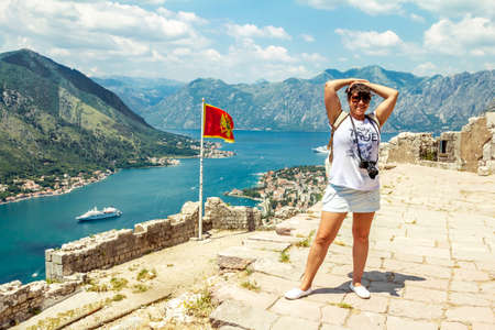 Kotor.Montenegro.June 5, 2015.A girl on the high platform of the Kotor fortress in Montenegro on a Sunny summer day.のeditorial素材