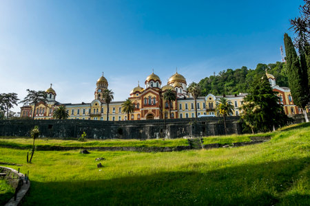New Athos. Abkhazia.June 04, 2022.New Athos monastery with bright golden domes at sunny summer day...