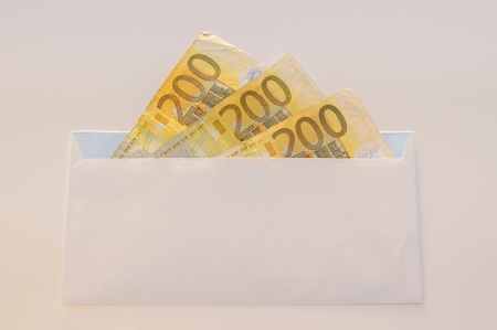 Euros, hundred, two hundred and coins on a white tableの写真素材
