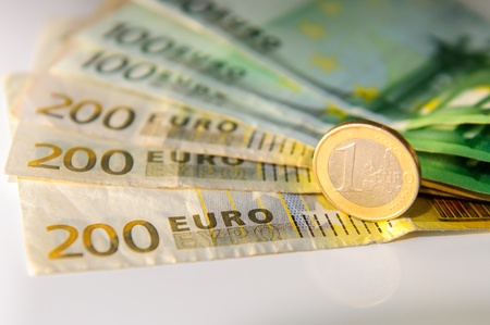 Euros, hundred, two hundred and coins on a white tableの写真素材