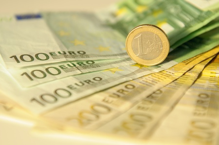 Euros, hundred, two hundred and coins on a white tableの写真素材