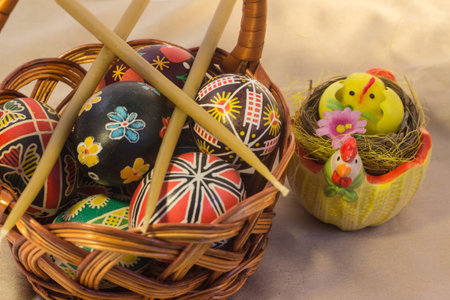 Easter basket filled with colorful eggs on a white background