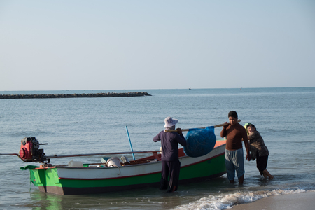 The fisherman was taking the crab net from theirs boat on the seaside of Chao Samran Beach Phetchaburi ProvinceThailand.のeditorial素材