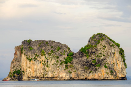 Mountain in the sea with cloudy sky in background,Koh(island) Ngai,Trange Province,Thailand.の写真素材
