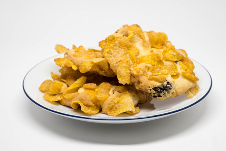 Cornflake and chocolate cookies on the plate with white background.の写真素材
