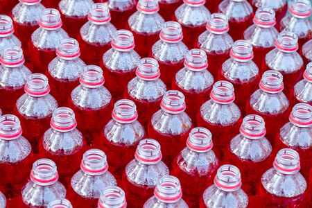 Group of bottle with red sweet water.の写真素材