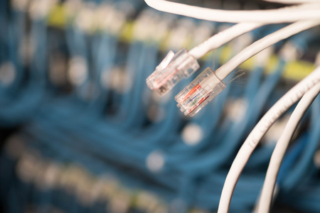 wire on network switches in background.の写真素材