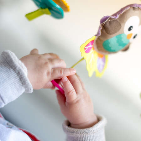 Happy newborn baby playing, family life conceptsの写真素材