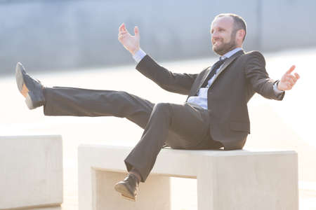 Happy and joyful businessman outdoor in the cityの写真素材
