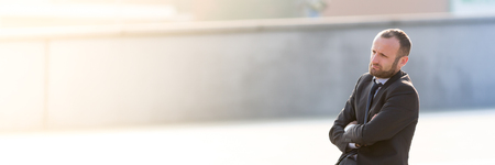 Frustrated and pensive businessman outdoor in the cityの写真素材