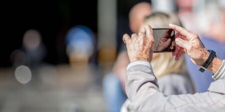 Tourist taking a picture outdoor, travel conceptsの写真素材