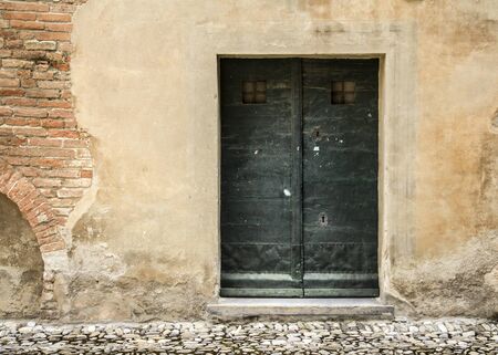 Typical old Italian door, classic building facadeの写真素材