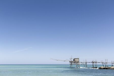 Mediterranean sea Italian coast with an old wooden pierの写真素材