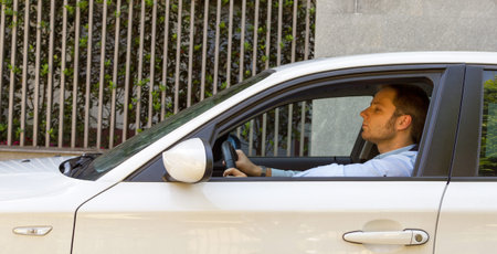 Happy businessman in his car, transportation and modern life concepts
