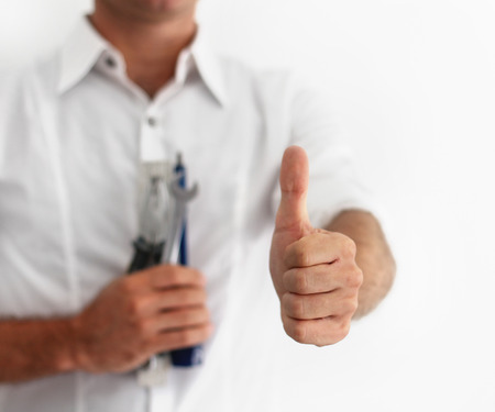 Happy repairman working in the house, construction and architecture conceptsの写真素材