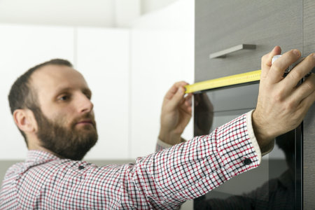 Builder manager measuring in the house, home renovation conceptsの写真素材