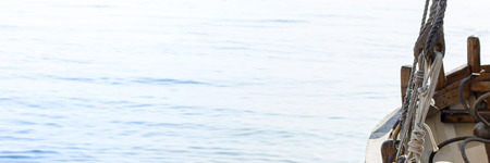 Old wooden traditional boat on the beachの写真素材