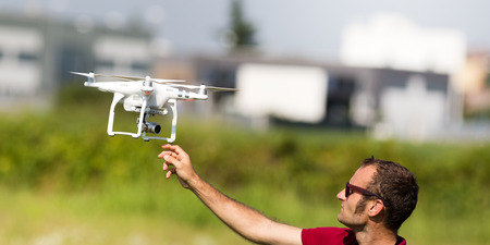 Quadcopter drone flying, technology and surveillance conceptsの写真素材