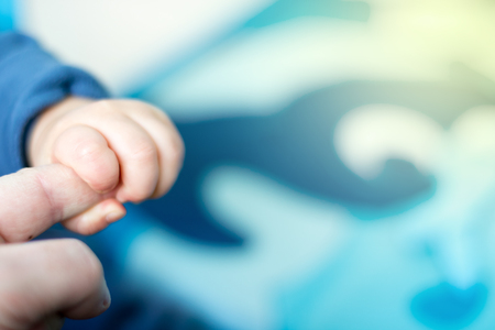 Cute and happy baby playing with his toysの写真素材