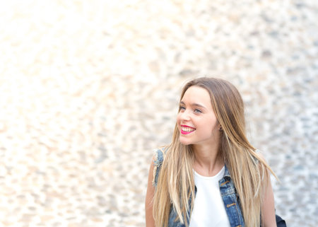 Happy young girl outdoor, horizontal banner photo with defocused copy space on the leftの写真素材