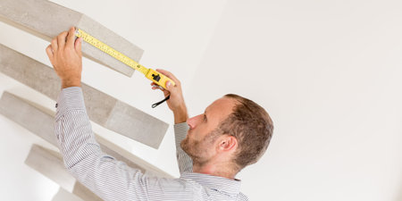 Architect taking measures of a concrete steps staircase. Home style and design concepts