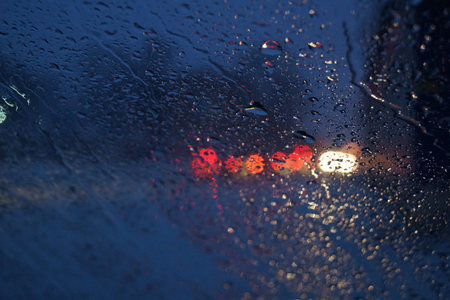 Rain on glass in cold autumn night