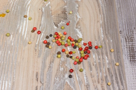 Colored Peppers Mix on the wood backgroundの写真素材