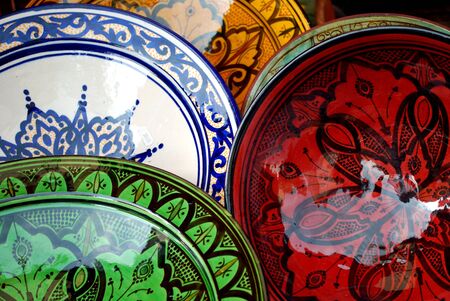 various colorful oriental pottery bowls on the marketの写真素材
