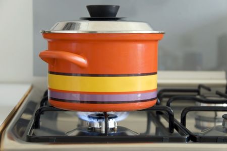 pot on a gas stove in the kitchenの写真素材