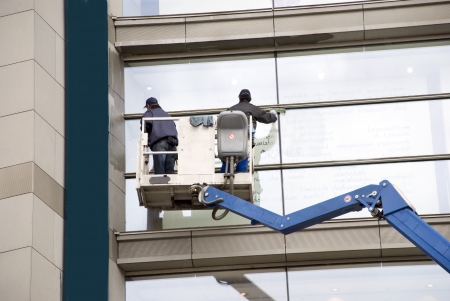 window washers on a hydraulic ramp window washers on a hydraulic ramp
