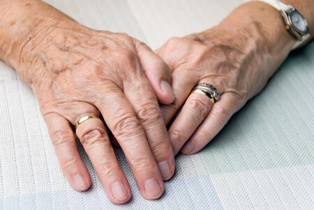 hands of an elderly woman in smooth lightの写真素材