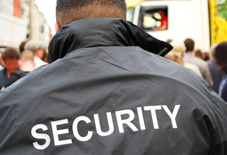 security guard in front of crowd