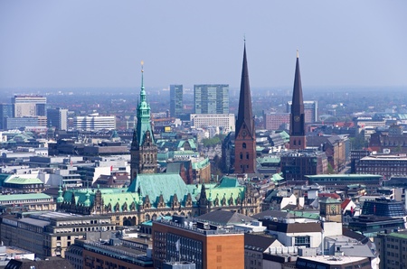 aerial photo over the roofs of hamburg with rathausの写真素材