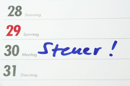 german word steuer on a white calendarの写真素材