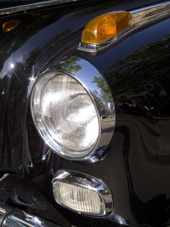 headlight and blinker of a black classic car mercedesのeditorial素材