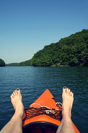 canoeing in summer in a lake in brandenburg, germanyの写真素材