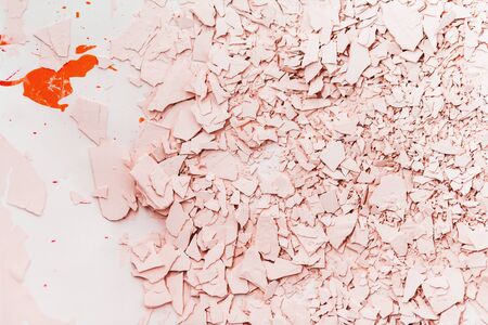 Textured plaster in pink tones. Cracked and broken plaster.の写真素材