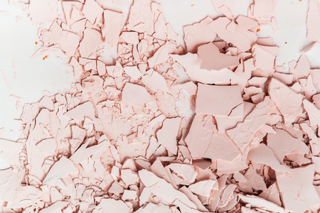 Textured plaster in pink tones. Cracked and broken plaster.の写真素材