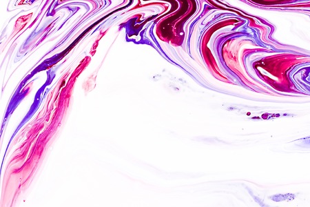 Mixture of acrylic paints. Modern artwork with spots and splashes of color paint. Liquid marble texture. Applicable for design packaging, labels, business cards, and interactive web backgroundsの写真素材