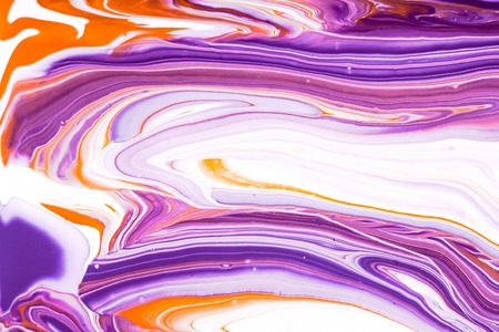 Mixture of acrylic paints. Modern artwork with spots and splashes of color paint. Liquid marble texture. Applicable for design packaging, labels, business cards, and interactive web backgroundsの写真素材