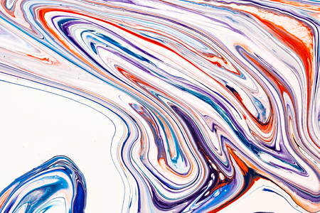 Mixture of acrylic paints. Blue, purple and coral red mixed acrylic paints. Liquid marble texture. Applicable for design packaging, labels, business cards, and interactive web backgrounds.の写真素材