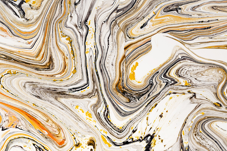 Mixture of acrylic paints. Modern artwork. Yellow and black mixed acrylic paints. Liquid marble texture. Applicable for design packaging, labels, business cards, and interactive web backgroundsの写真素材