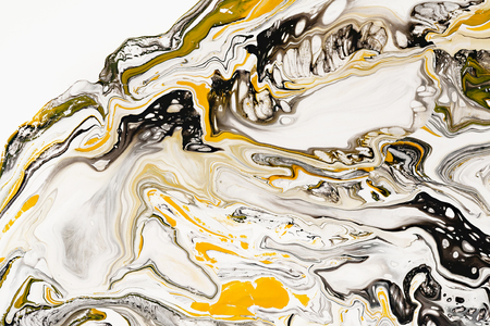 Mixture of acrylic paints. Modern artwork. Yellow and black mixed acrylic paints. Liquid marble texture. Applicable for design packaging, labels, business cards, and interactive web backgrounds.の写真素材