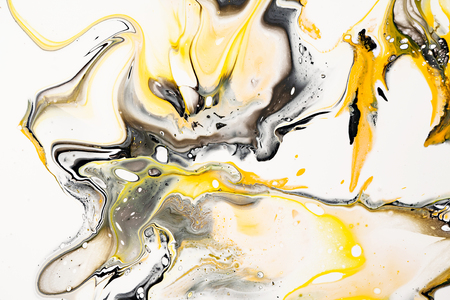 Mixture of acrylic paints. Modern artwork. Yellow and black mixed acrylic paints. Liquid marble texture. Applicable for design packaging, labels, business cards, and interactive web backgrounds.の写真素材