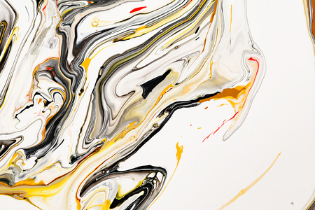 Mixture of acrylic paints. Modern artwork. Yellow and black mixed acrylic paints. Liquid marble texture. Applicable for design packaging, labels, business cards, and interactive web backgrounds.の写真素材