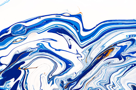 Hand painted background with mixed liquid blue, white, yellow paints. Abstract fluid acrylic painting. Applicable for packaging, invitation, textile, wallpaper, design of different surfacesの写真素材